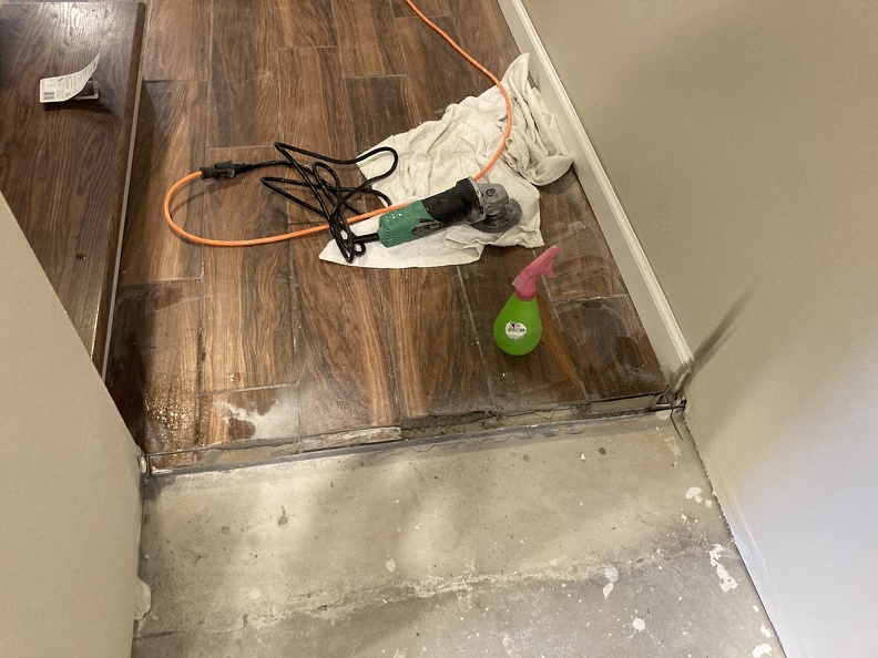 Cutting back Entrance Tile to where one was cracked.JPG
